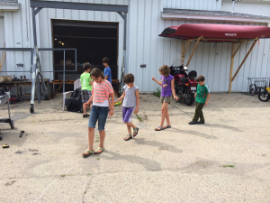 Program participants measuring the circumference of a circle to estimate π